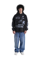 Person wearing a black hoodie with white text and graphics on a gray background